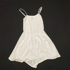 White romper. Only worn once. Form fitting on top loose at bottom.